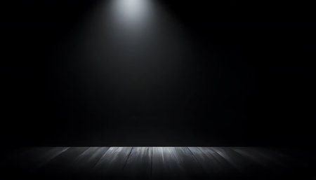 Empty room with wooden floor and spotlights on a black background.の写真素材