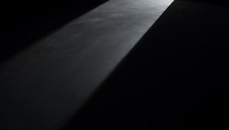 Abstract black background with light and shadow. Light from the window.の写真素材