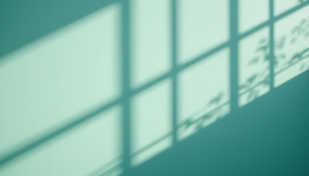 Shadow of window on green wall. Abstract background and texture for design.の写真素材