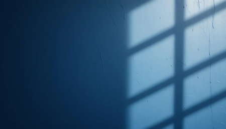 Shadow of window on blue wall. Abstract background. Copy space.の写真素材