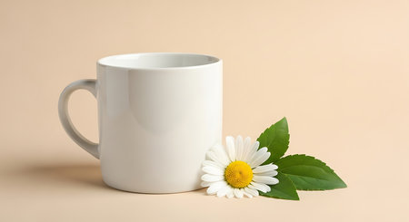 White cup with chamomile flower on beige background.の写真素材