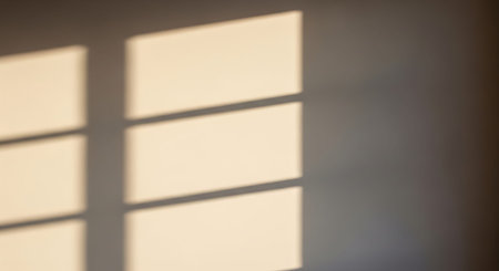 Shadow of window on white wall. Abstract background and texture for design.