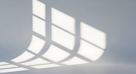 A minimalistic composition showcasing the interplay of light and shadow from a window creating...