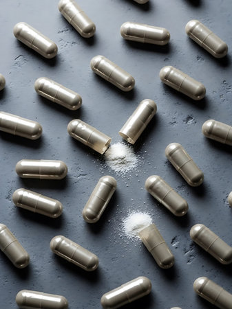 Pills and powder on a dark background. Selective focus.