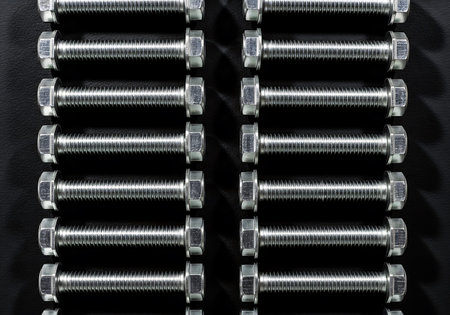 Metal bolts on a black background. Close-up. Selective focus.の写真素材