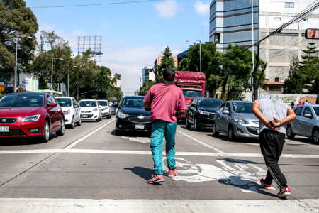 Mexico city, Mexico; 10 20 2018: Mexican street performers dancing on traffic light.のeditorial素材