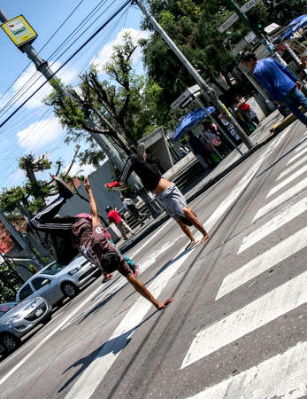 Mexico city, Mexico; 10 20 2018: Mexican street performers dancing on traffic light.のeditorial素材