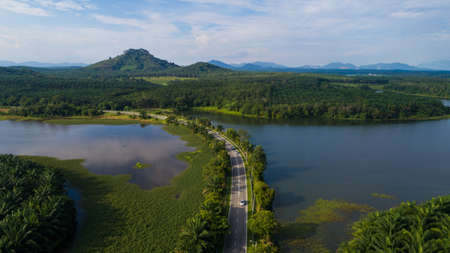 Aerial view of reservoir dam during sunny day.の写真素材