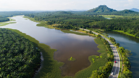 Aerial view of reservoir dam during sunny day.の写真素材