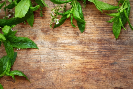 Green mint leaves on wooden backgroundの写真素材