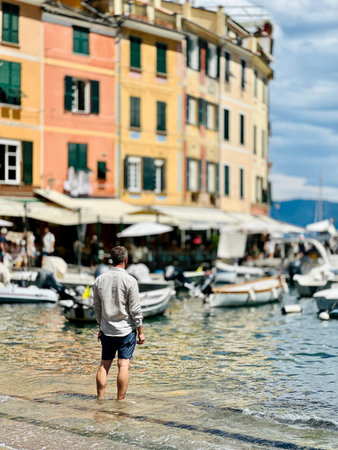 Man walking on the seafront in Portofino, Liguria, Italyの写真素材