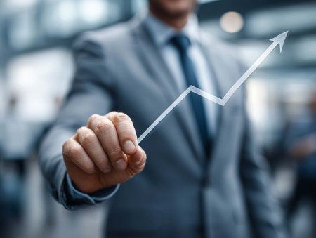 businessman with financial symbols coming from hand (shallow DOF)の素材