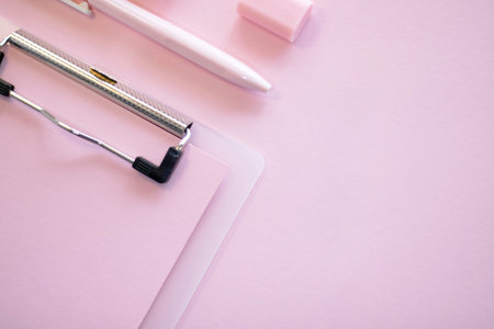 School office supplies on a pink background. Back to school creative illustration, template.の写真素材