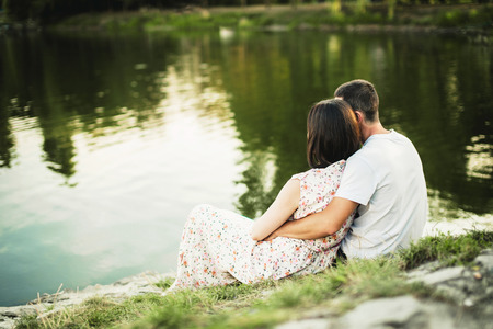 Lovers on the beach of the riverの写真素材