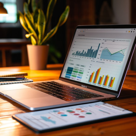 Laptop with financial charts and graphs on screen. Business and finance conceptの素材