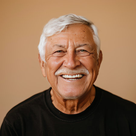 Portrait of a senior man with white teeth smiling at the cameraの素材