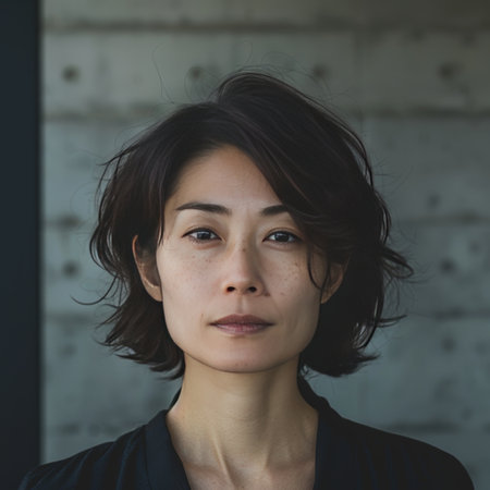 Portrait of a beautiful young woman in a black blouse and blue shirtの素材