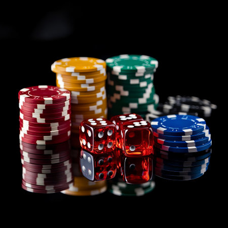 Poker chips and dices on black background. Casino concept.の素材
