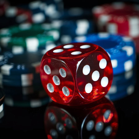 Red dice on black background. Casino concept. Selective focus.の素材
