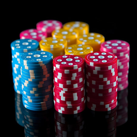 Colorful casino chips on a black background with reflection. Selective focus.の素材