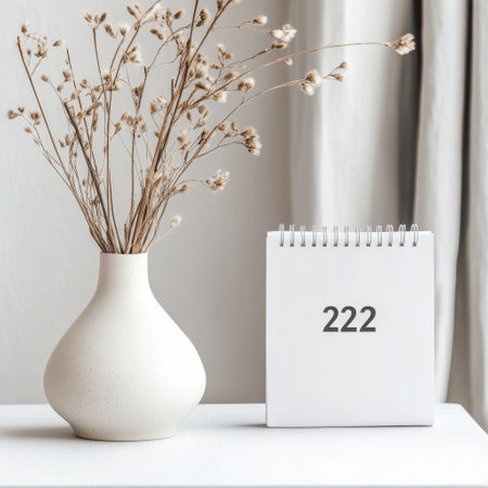 White vase with dried flowers on the table and calendar 2022.の素材