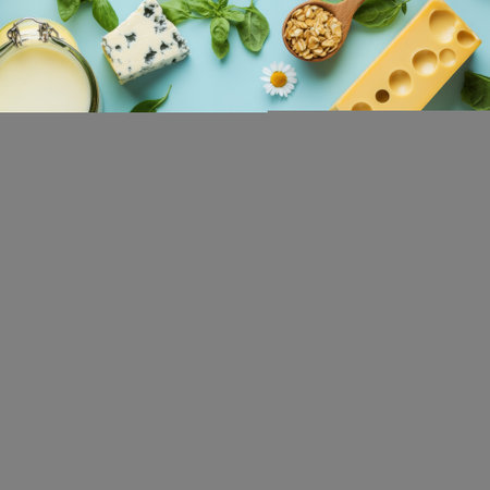 Top view of dairy products with cheese, basil, nuts and milk on blue backgroundの素材