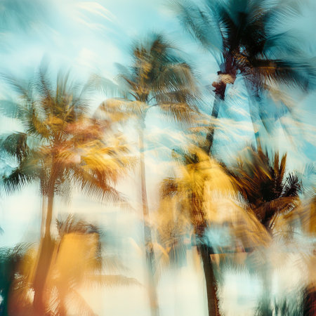 Tropical palm trees on blurred background, toned picture.の素材