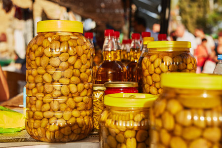 olives in jars in olive oil for sail