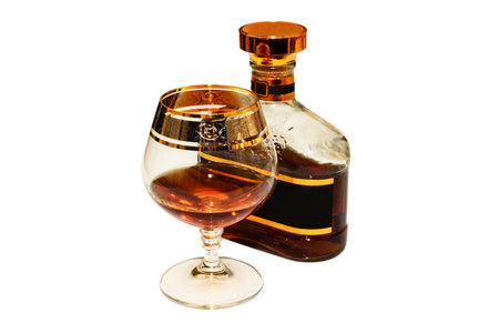 Bottle and glass of alcoholic drink.