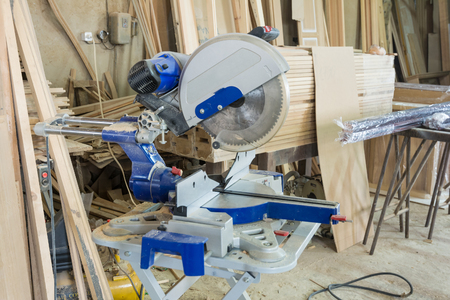 Tools in the carpentry workshop: electric circular saw.の写真素材