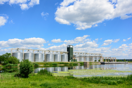 Grain elevator in agricultural zone. Granary with mechanical equipment for receiving, cleaning, drying, grain shipment.の写真素材