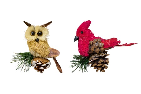 Christmas and New Year decorations: figurines of toy owl and northern cardinal. Isolated, white background.の写真素材