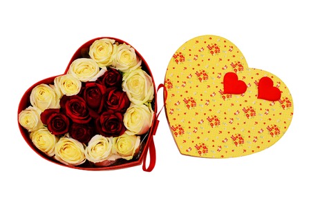 Gift box in the form of heart with scarlet bow, white and red live roses. Valentines Day concept. Isolated, white background.の写真素材