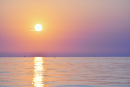 Sunrise at the sea. Seascape of the morning dawn. Early morning on the beach.の写真素材