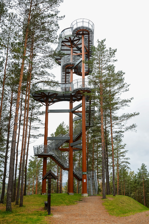 Staircase of lookout tower, construction with metal steps. Observation tower, post or point, place from which to keep watch or view landscape. Tourist attraction.のeditorial素材