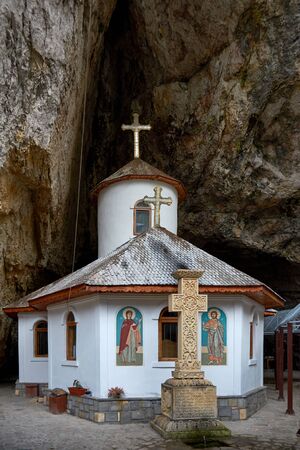 Ialomita Cave Monastery is located in Moreni commune, in the Bucegi Mountains, Romania. The monastery is located at the entrance to the Lalomita Cave. Religious building, Orthodox Christian temple.の写真素材
