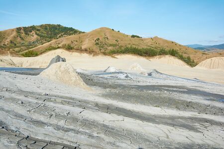 Muddy volcanoes Paclele Mari near Buzau, Romania. Mud and natural-gas eruptions create small volcanoes in natural reserve.の写真素材