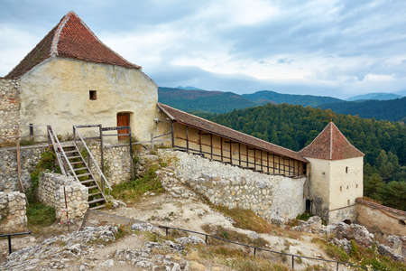 View of the ramparts and towers of the medieval fortress of Rasnov, Romania. City landscape of the ancient town.のeditorial素材