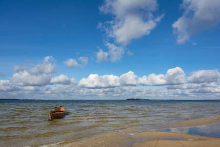 Svitiaz Lake, Shatsk National Natural Park, Volyn region, Ukraine. The Shatskyi Lakes group. Boat on the shore of the lake. Beach by the lake.の写真素材