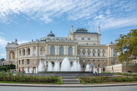 Odesa, Ukraine - September, 30, 2023: Autumn day in Odesa, warm sunny weather. On a day off during the war, people walk near the theater. Odesa National Academic Theater of Opera and Ballet, architectural landmark, Ukraine.のeditorial素材