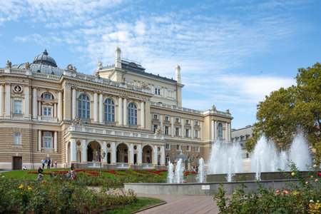 Odesa, Ukraine - September, 30, 2023: Autumn day in Odesa, warm sunny weather. On a day off during the war, people walk near the theater. Odesa National Academic Theater of Opera and Ballet, architectural landmark, Ukraine.のeditorial素材