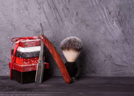 Razors, brush, christmas gift  on a wood backgroundの写真素材