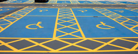 The disabled parking yellow and blue signの写真素材
