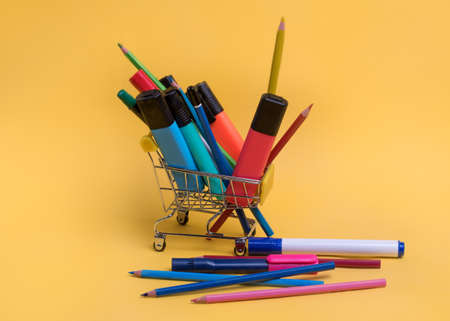 Shopping cart with colorful stationeryの写真素材