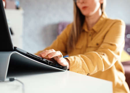 businesswoman working on laptop at homeの写真素材