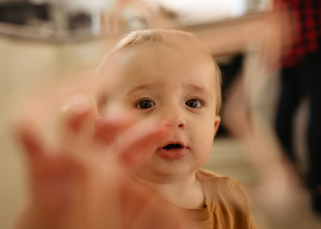 mother and son in kitchen at homeの写真素材