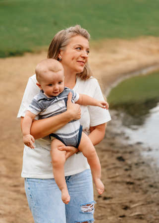 mother holding and hugging sonの写真素材