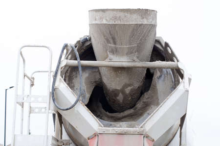 Ready-mix semi-dry concrete delivered on construction site and discharged from the mixing truckの写真素材