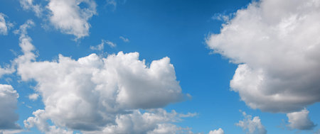 white cirrus, feathery clouds against spring bright blue cloudy sky at the sunset in England