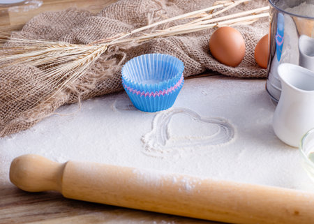 baking ingredients egg, flour, oil for baking on wooden backgroundの写真素材